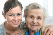 senior and caregiver smiling